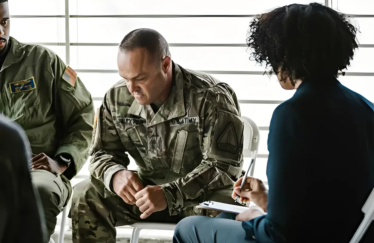 Military personnel in a counseling session.