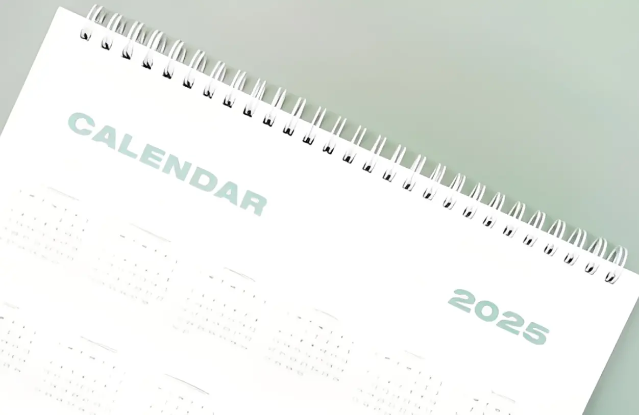 2025 spiral-bound calendar close-up view.
