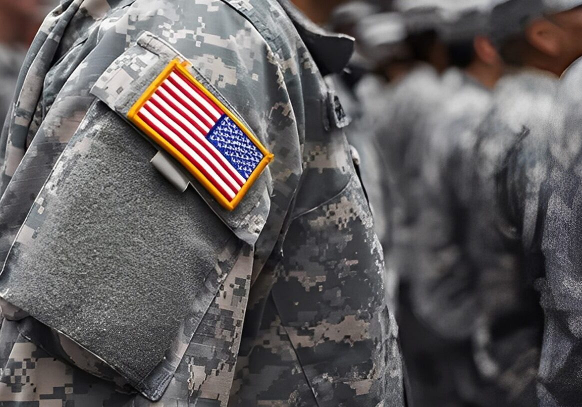 U.S. flag patch on military uniform sleeve.